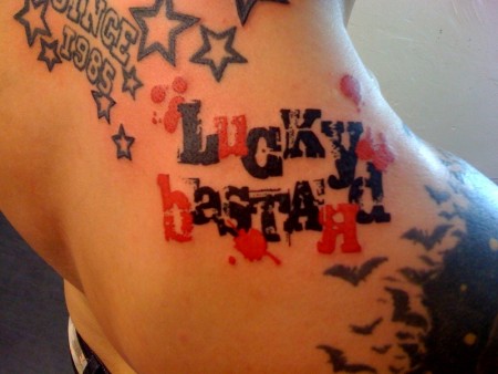 schrift-Tattoo: Lucky Bastard