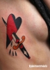 Traditional dagger and heart tattoo