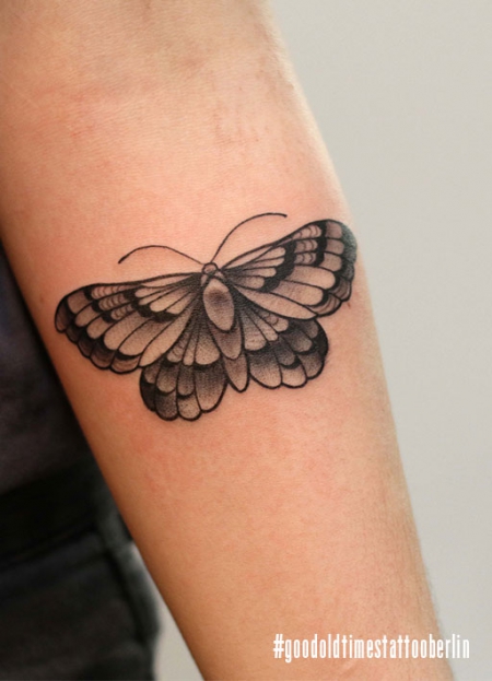 Blackwork moth tattoo
