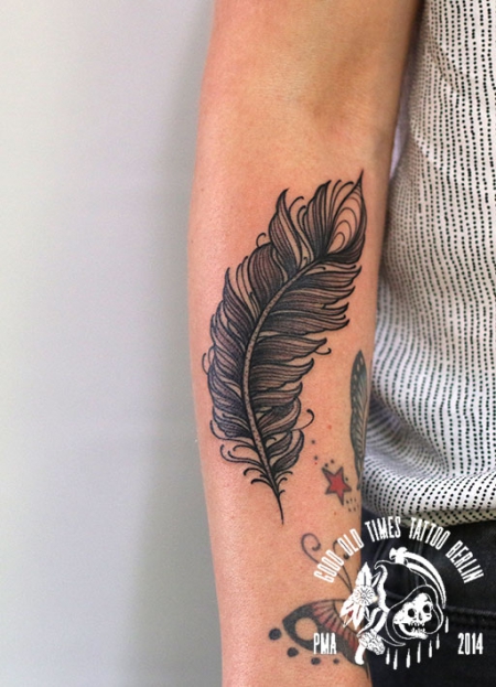 blackwork feather tattoo