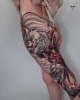 Drache und Spinnenlilien / vollständig verheiltes Bein Tattoo Rückseite