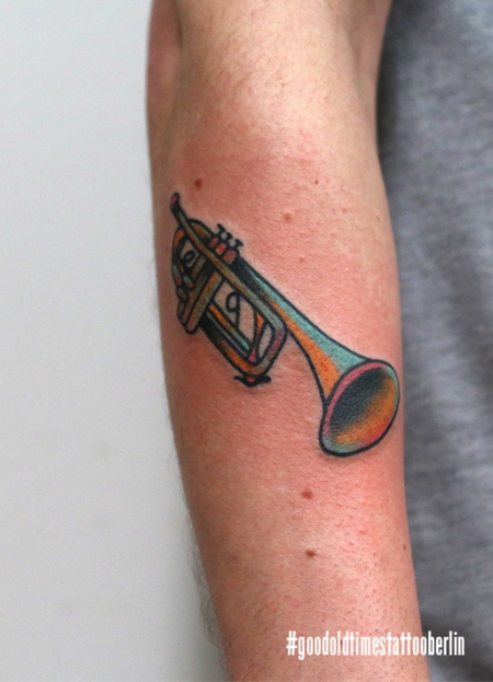 Traditional trompet tattoo