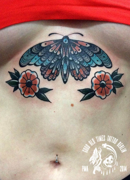 traditional underboob moth tattoo